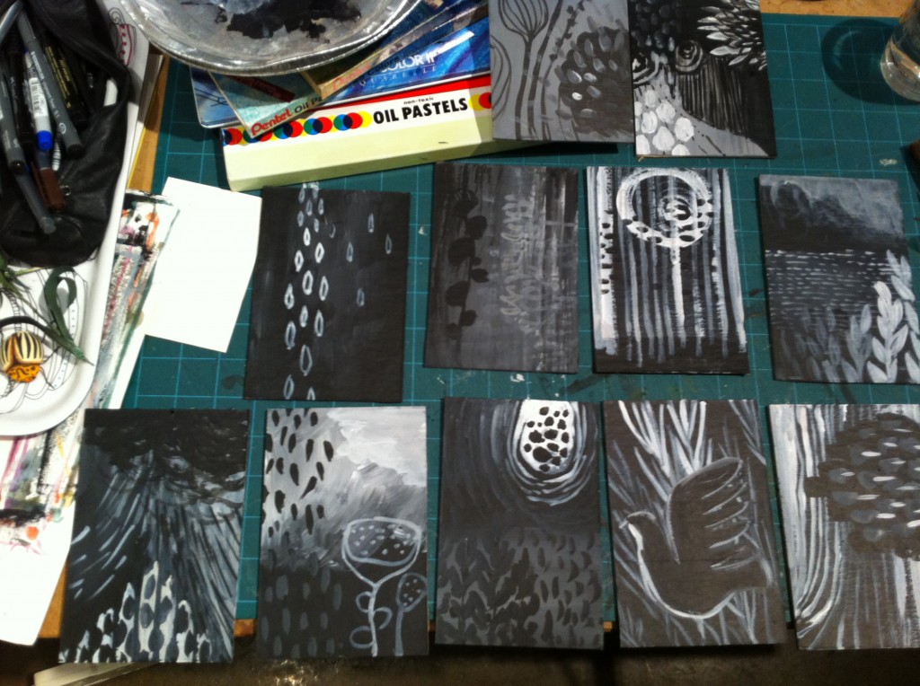 Using black and white gesso on cardboard I created abstract landscapes